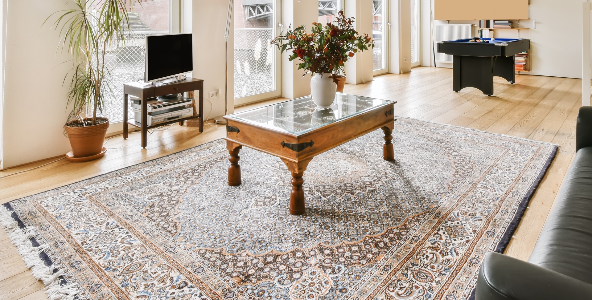 Lovely living room with black leather sofa mattress cleaning